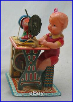 Vintage 1950's Tin Wind-Up Sewing Machine with Celluloid Girl Japan by Marusan