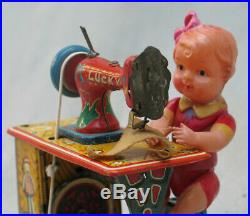 Vintage 1950's Tin Wind-Up Sewing Machine with Celluloid Girl Japan by Marusan